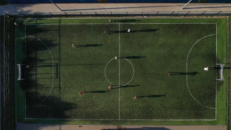 top-view-of-a-sports-soccer-field-with-people-play-2022-08-04-21-22-51-utc_1